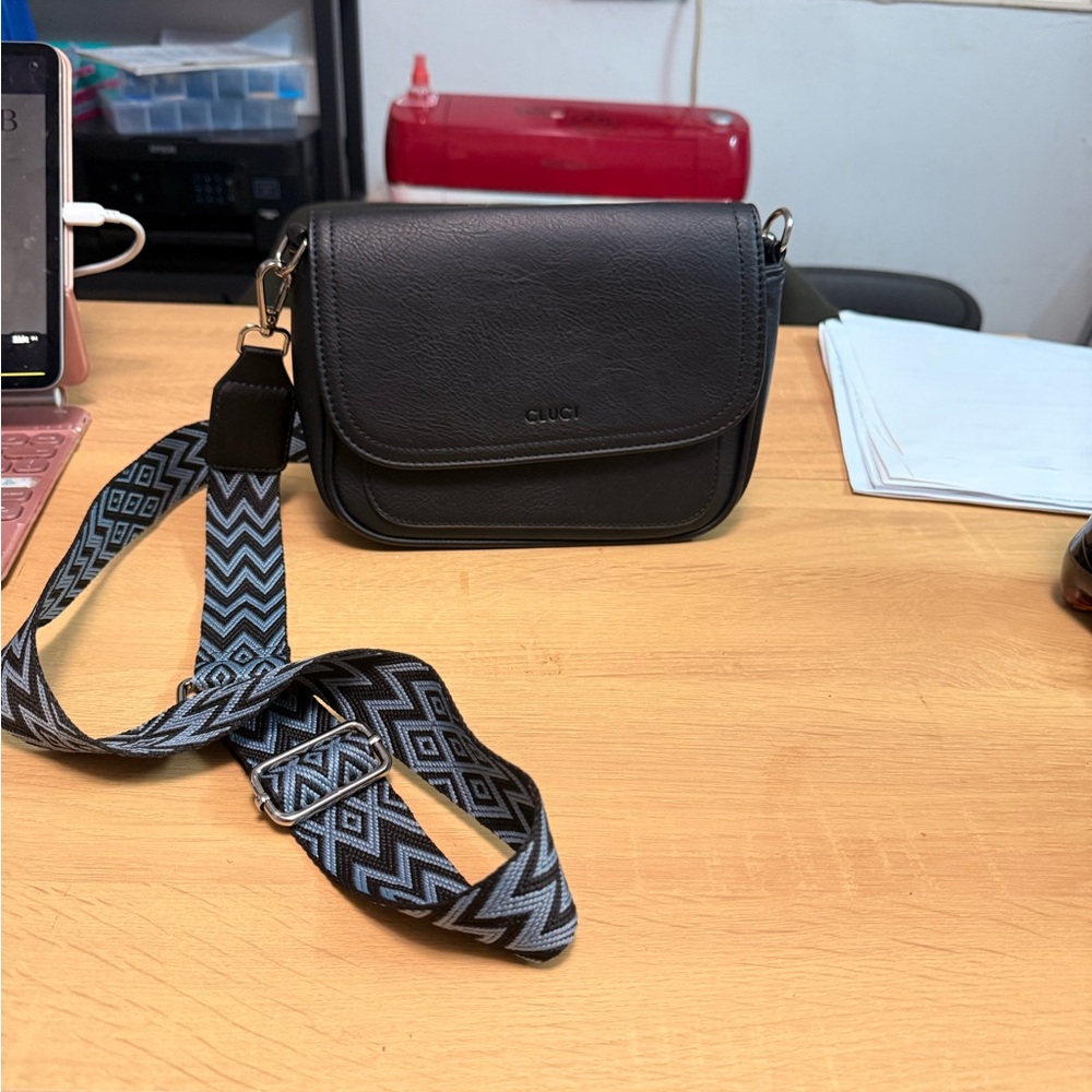 Elegant Black Crossbody Bag with Patterned Strap